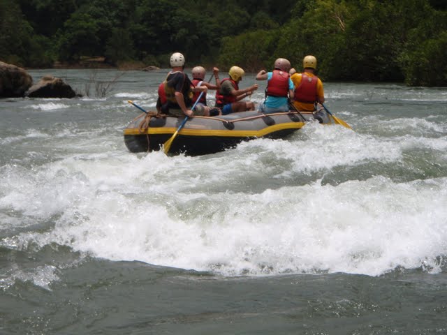 Rubber dinghy moving away from the rapids